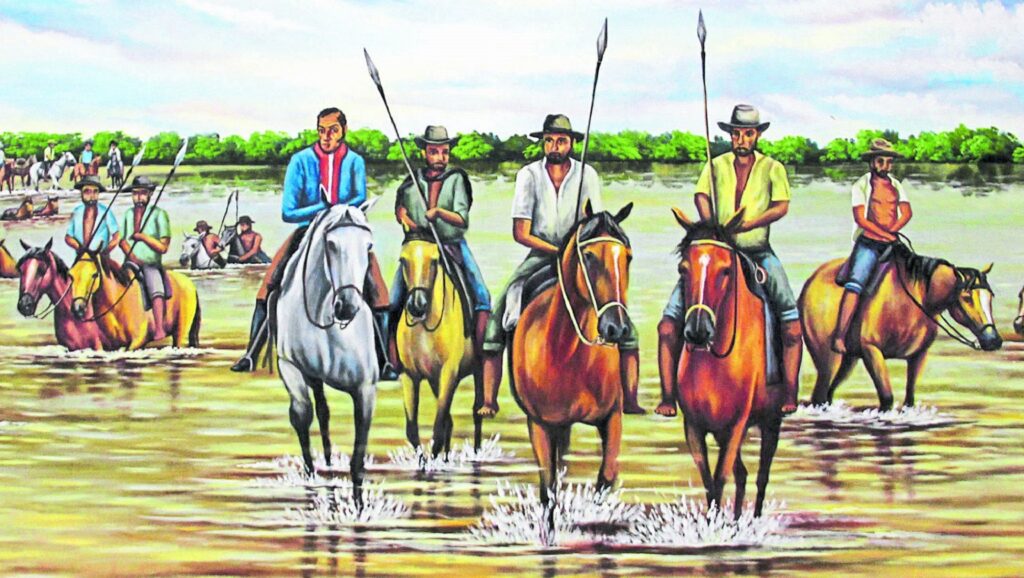 Simón Bolívar atravesando en caballo el río Arauca